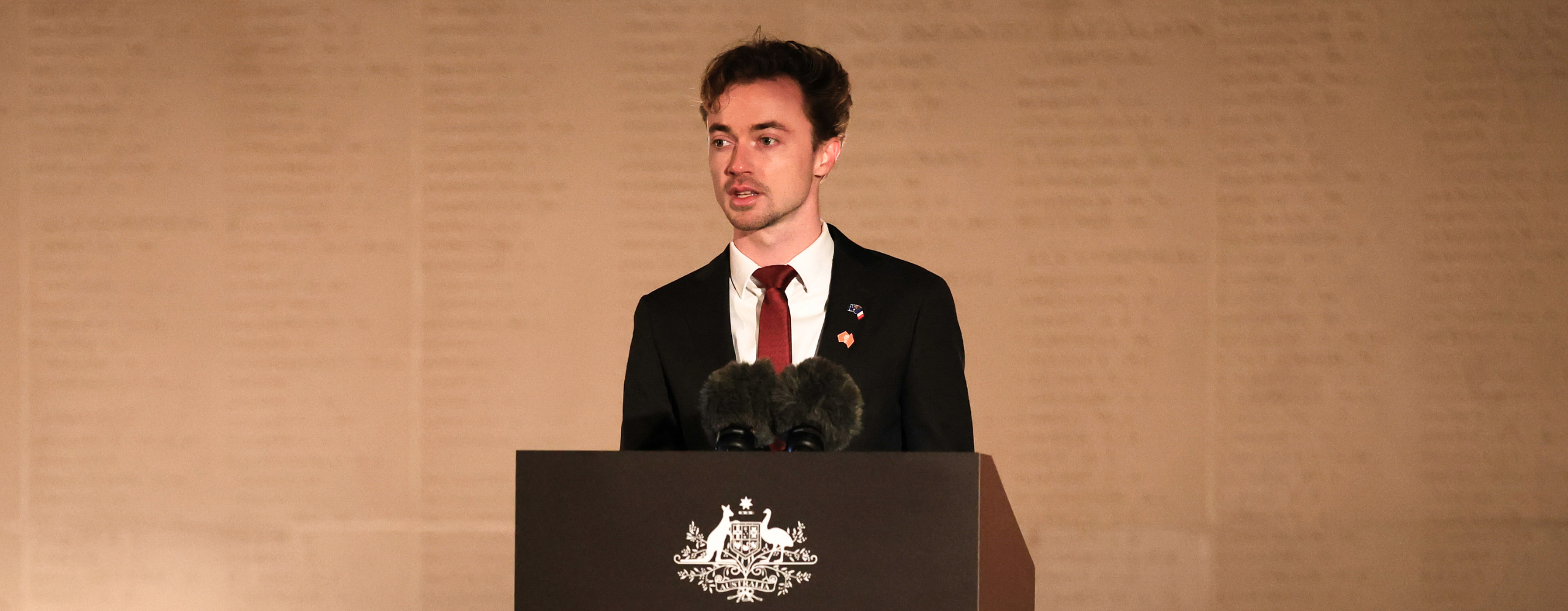 Nick Bradman delivering ANZAC dawn service address in France
