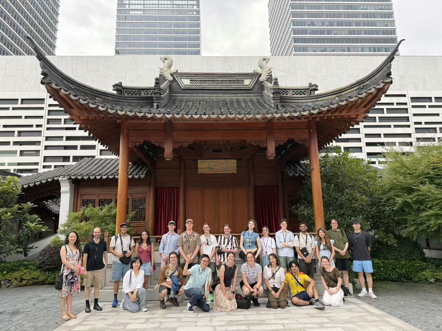 A group photo of the cohort in front of a Chinese traditional pavillion 