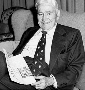 A person in a suit and tie sitting in a chair

AI-generated content may be incorrect.