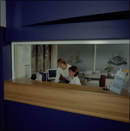 A person standing behind a counter

AI-generated content may be incorrect.