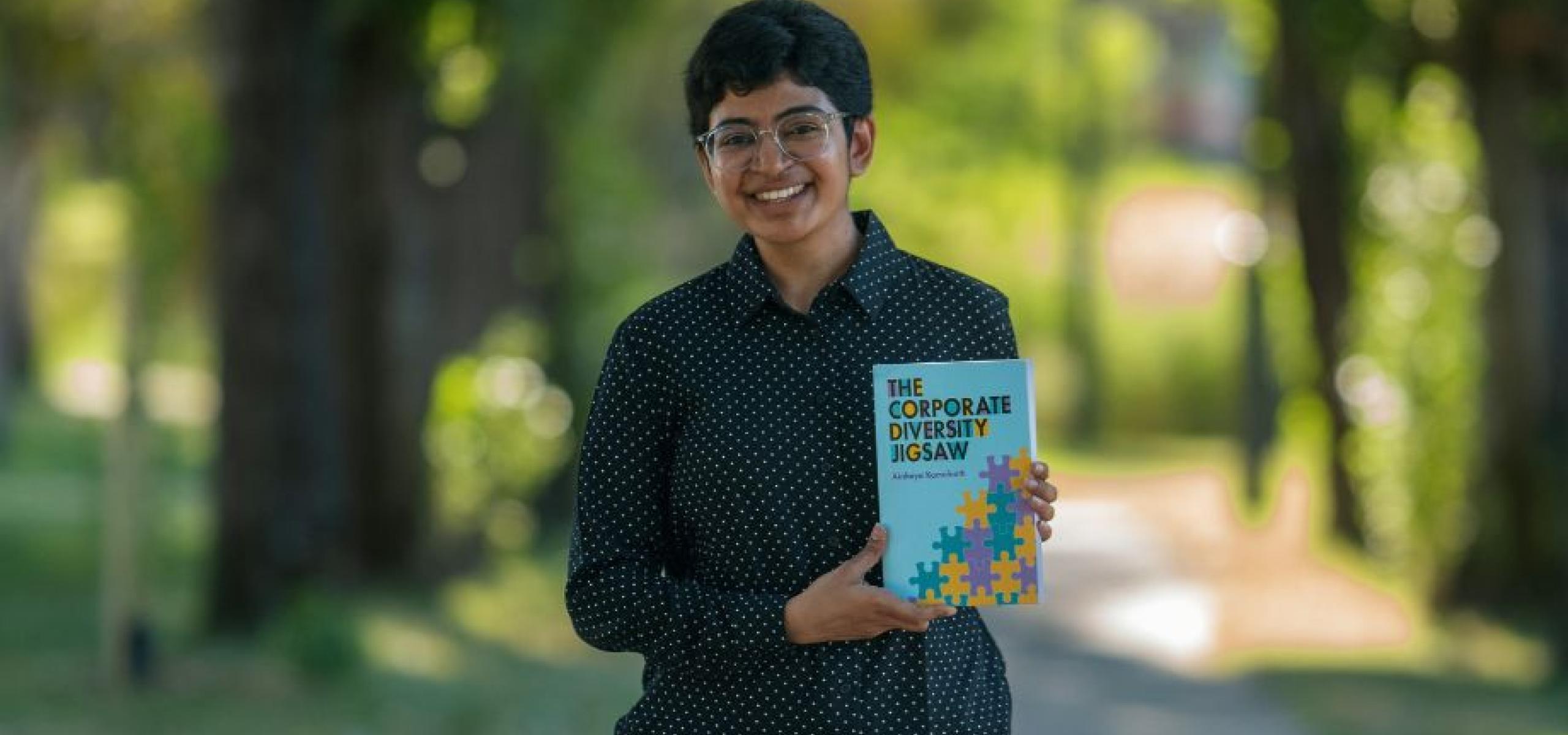 Dr Akshaya Kamalnath holds her book, 'The Corporate Diversity Jigsaw'